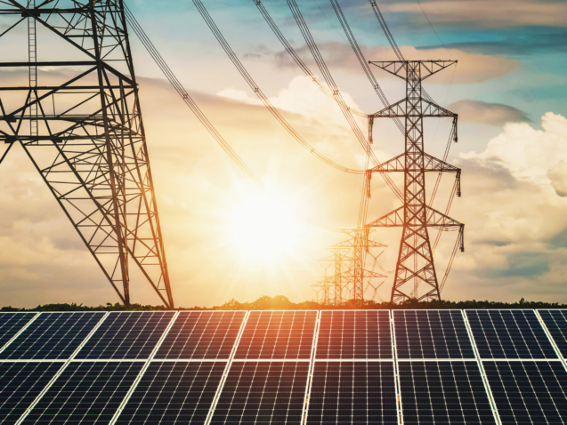 Solar panels with electricity pylon and sunset. Clean power energy concept